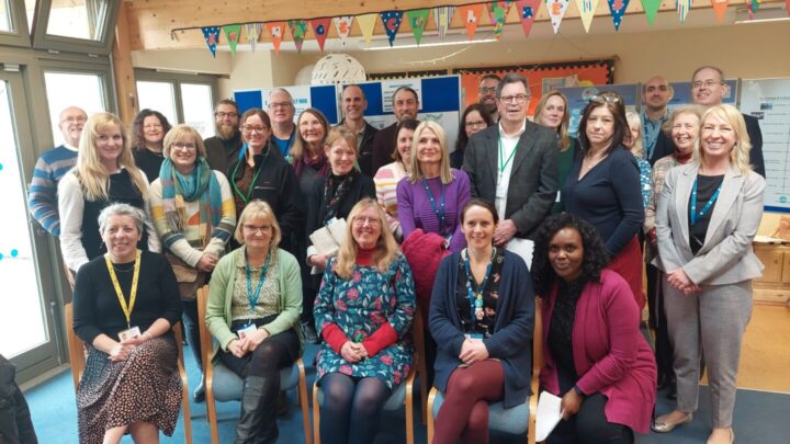 The image shows a group of people who attended the Swange stakeholder event in February