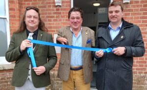 Councillors cutting the ribbon outside the property