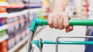 Person pushing trolley round a supermarket