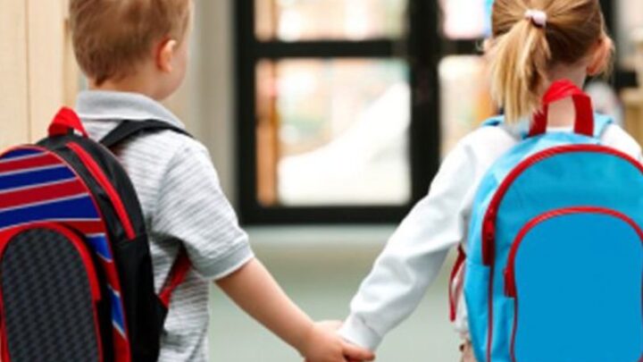 Boy and girl approaching school