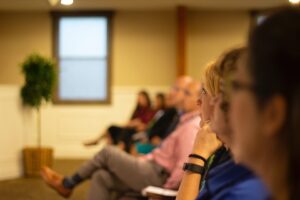 Delegates listening to a speaker at an event