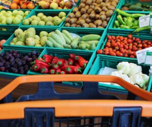 Shopping trolley in front of fruit