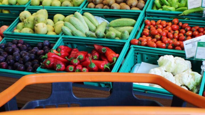 Shopping trolley in front of fruit