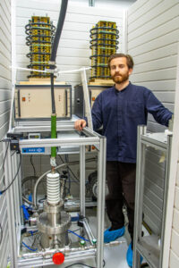 Dr Tom Wallace Smith with his MSF Reactor inside the bunker he made for Astra System's base at the Dorset Innovation Park