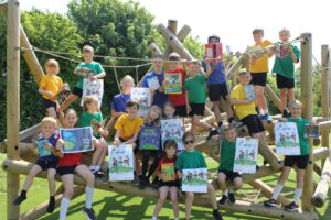 Group of schoolchildren on playground equipment