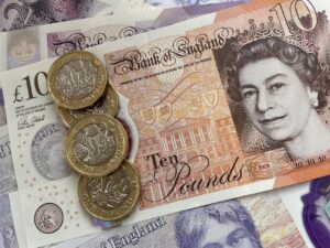 variety of UK money notes and coins