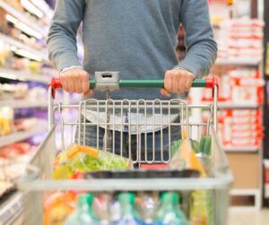 Someone pushing a trolley down an aisle
