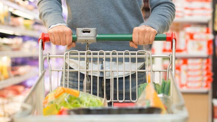 Someone pushing a trolley down an aisle