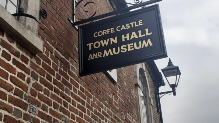 Building sign for Corfe Castle Town Hall and Museum