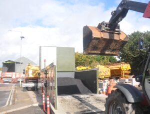 the hotbox, a large box containing asphalt with a tractor approaching to remove asphalt