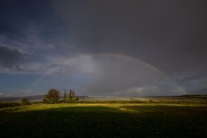 A rainbow in stormy skies. near Sixpenny Handley in the Cranborne Chase National Landscape (previously AONB).